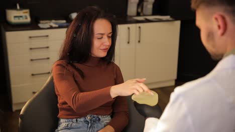 doctor discussing breast implant options with patient