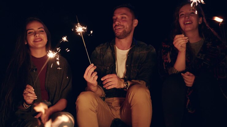 Friends Celebrating With Sparklers At