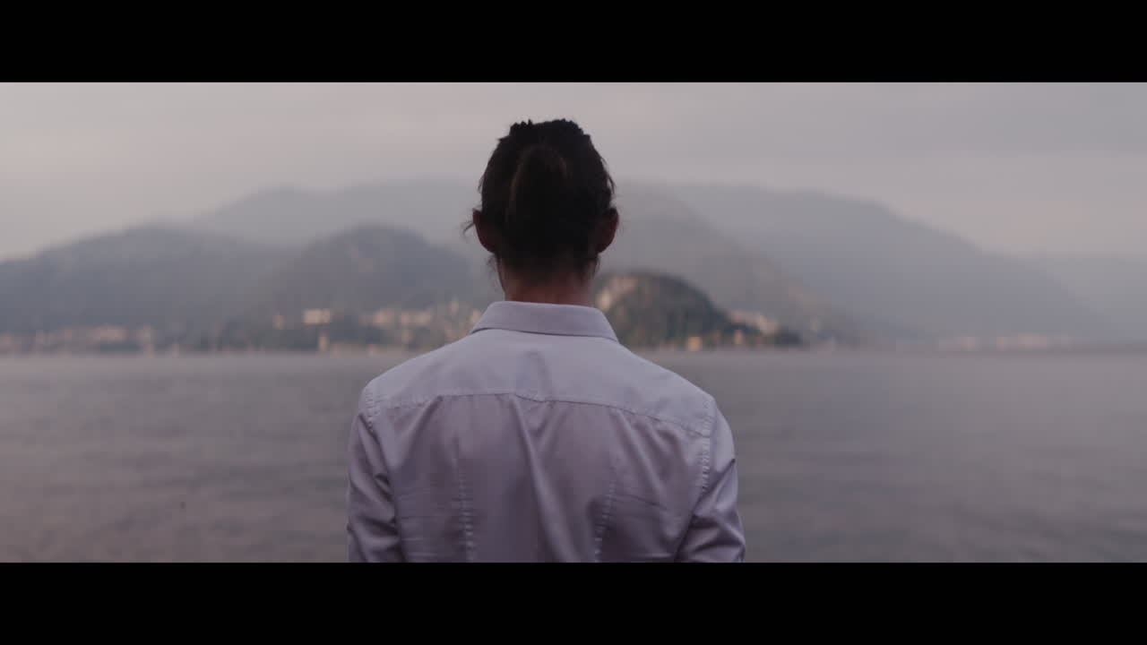 Woman Contemplating a Lakeside View