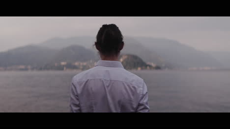 woman contemplating a lakeside view