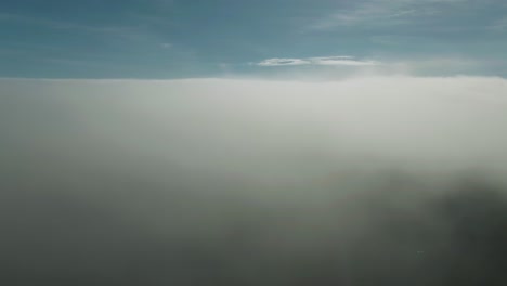 Aerial-Flight-Through-The-Clouds-Moving-Towards-The-Drone-Camera-Above-Magdalen-Islands-In-Northern-Quebec,-Canada