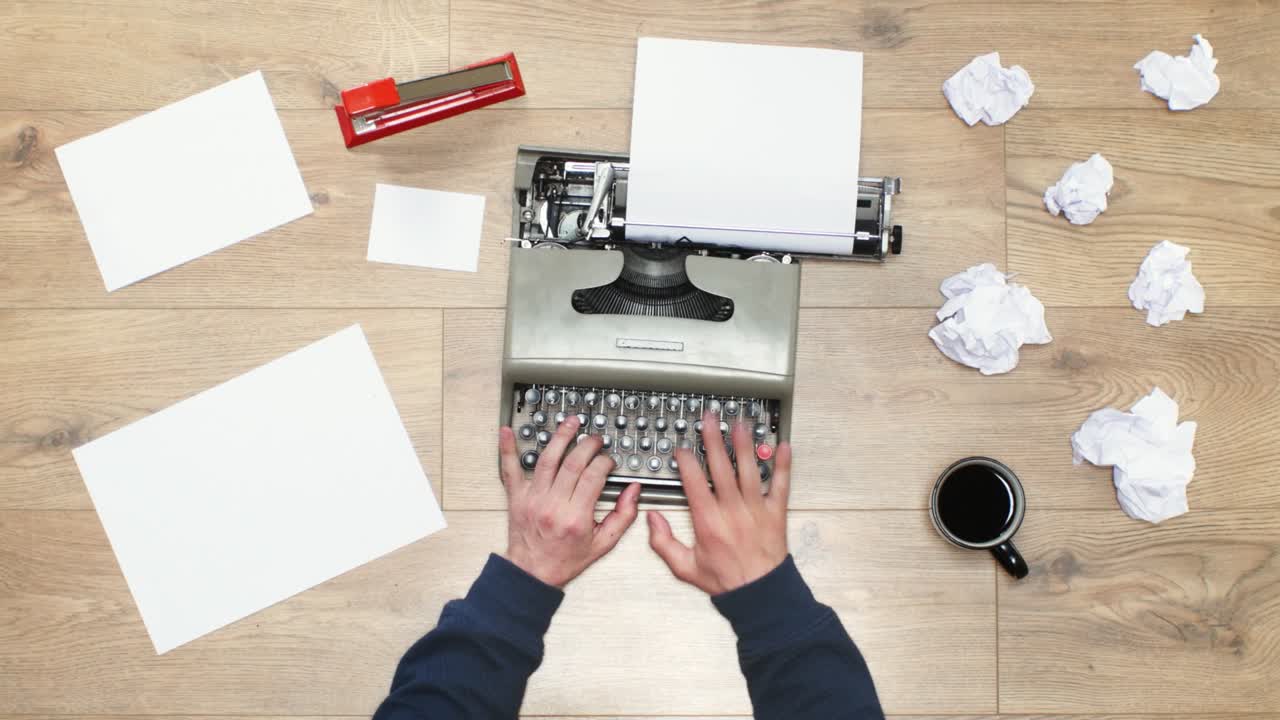 Man’s hands using a vintage typewriter, shallow depth of field & backlit. Writing a book or and a movie script. Big range of typewriter shots on the gallery