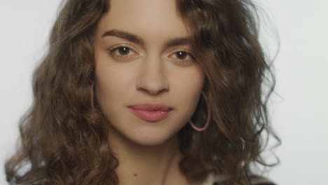 happy woman sending air kiss to camera