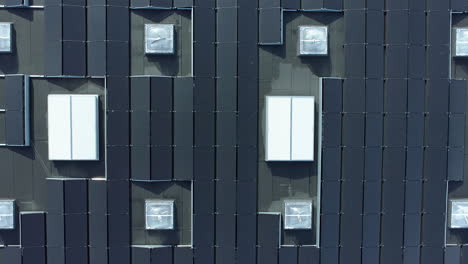 aerial vertical top down view, solar panels on industrial roof, sunny