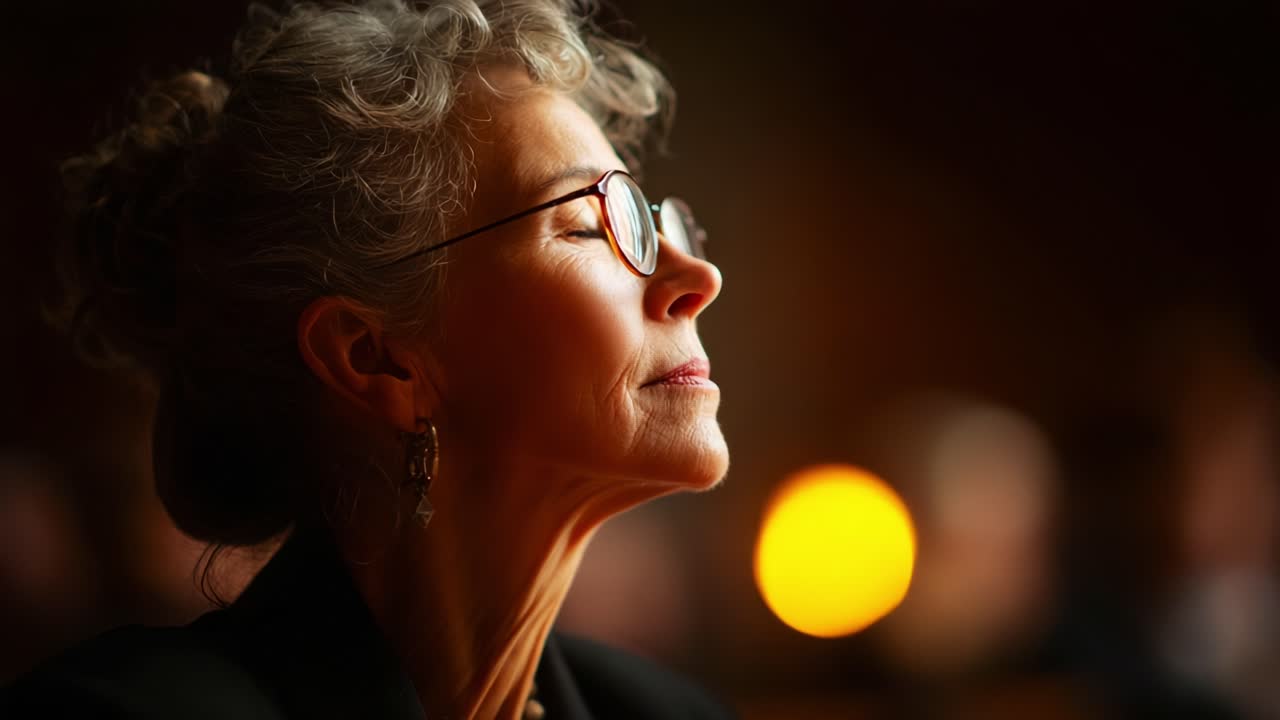 A Reflective Moment: Capturing the Serenity and Depth of a Woman in Profile, Illuminated by Warm Light and Surrounded by a Slightly Blurred Background of Soft Colors