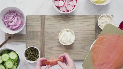 assembling bagel brunch board