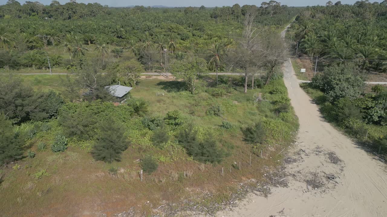Aerial Drone View During Summer Alit Fishing Village,Kabong With, Facing Open Blue Sea, White Sandy Beach,Green Coconut, Palm Trees,And River,Sarawak,Borneo