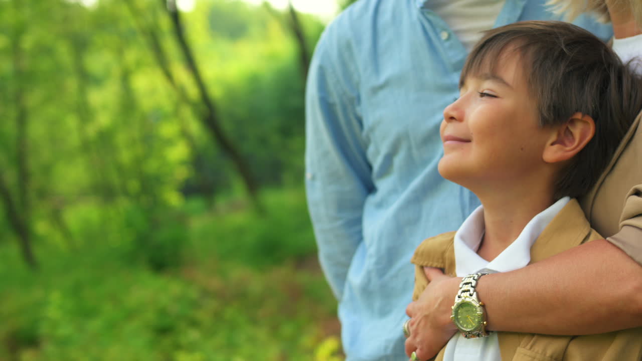 A family embracing outdoors