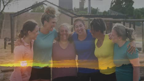 animation of sunset over diverse women at obstacle course embracing