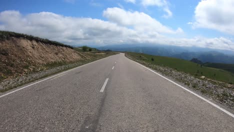 point of view driving a car on a road