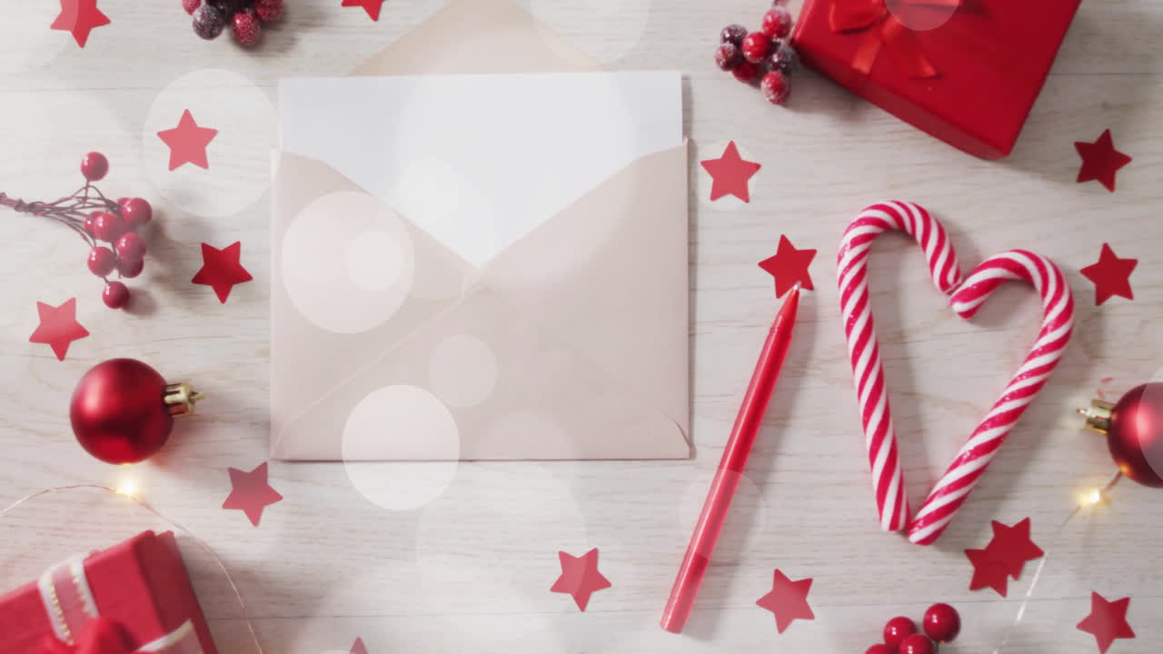 Christmas decorations with envelope and candy cane heart over red stars animation