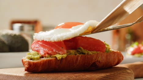 avocado toast with salmon and fried egg