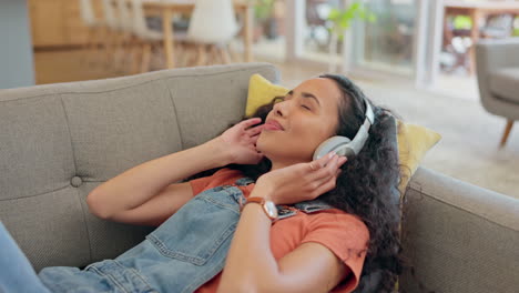 headphones, relax and woman on sofa