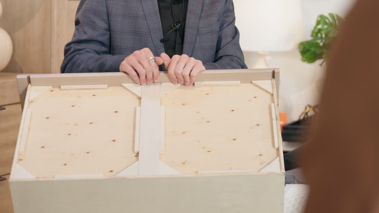 Over-Shoulder View of Suit Presenter Demonstrating High-Quality Drawer Build