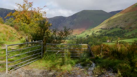 Tracking-shot-past-a-gate-to-mountains-in-North-Wales-in-the-UK