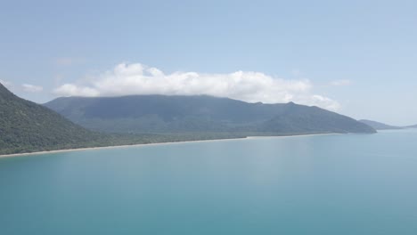 beautiful calm blue waves by struck island in queensland, australia -aerial