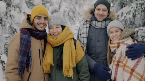 friends enjoying a winter day in a snowy forest