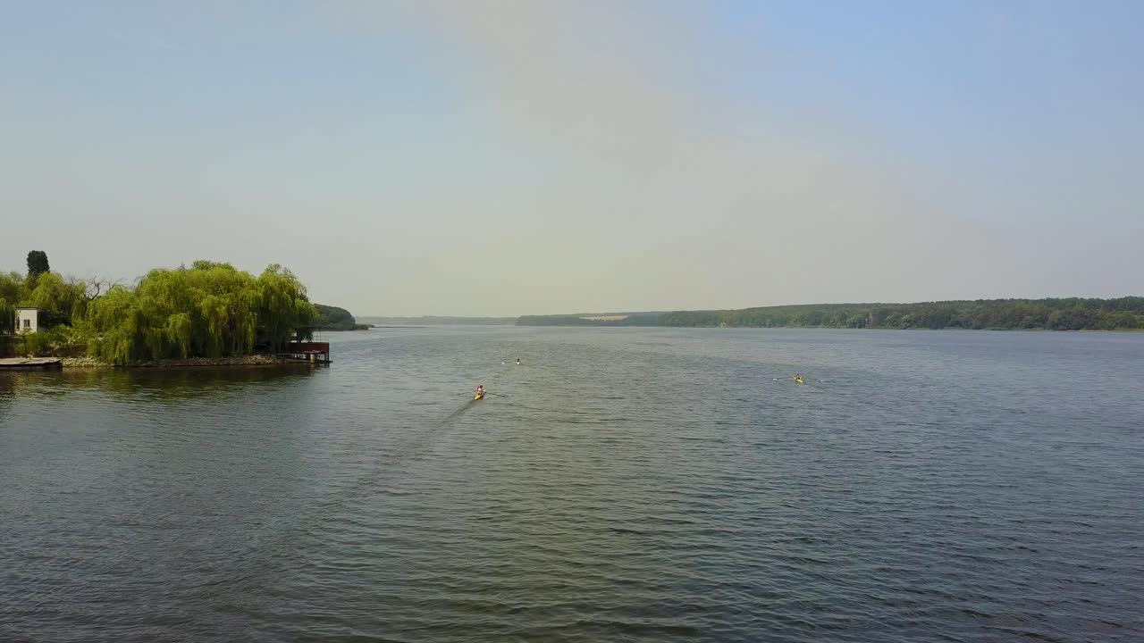 Kayakers Training On Canoe. Active children training in kayak on the river