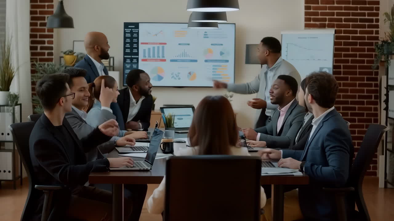 Diverse business team collaborating in a corporate meeting with data presentation