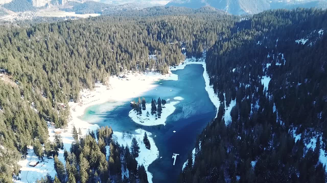 Aerial View of a Frozen Lake in the Snowy Mountains