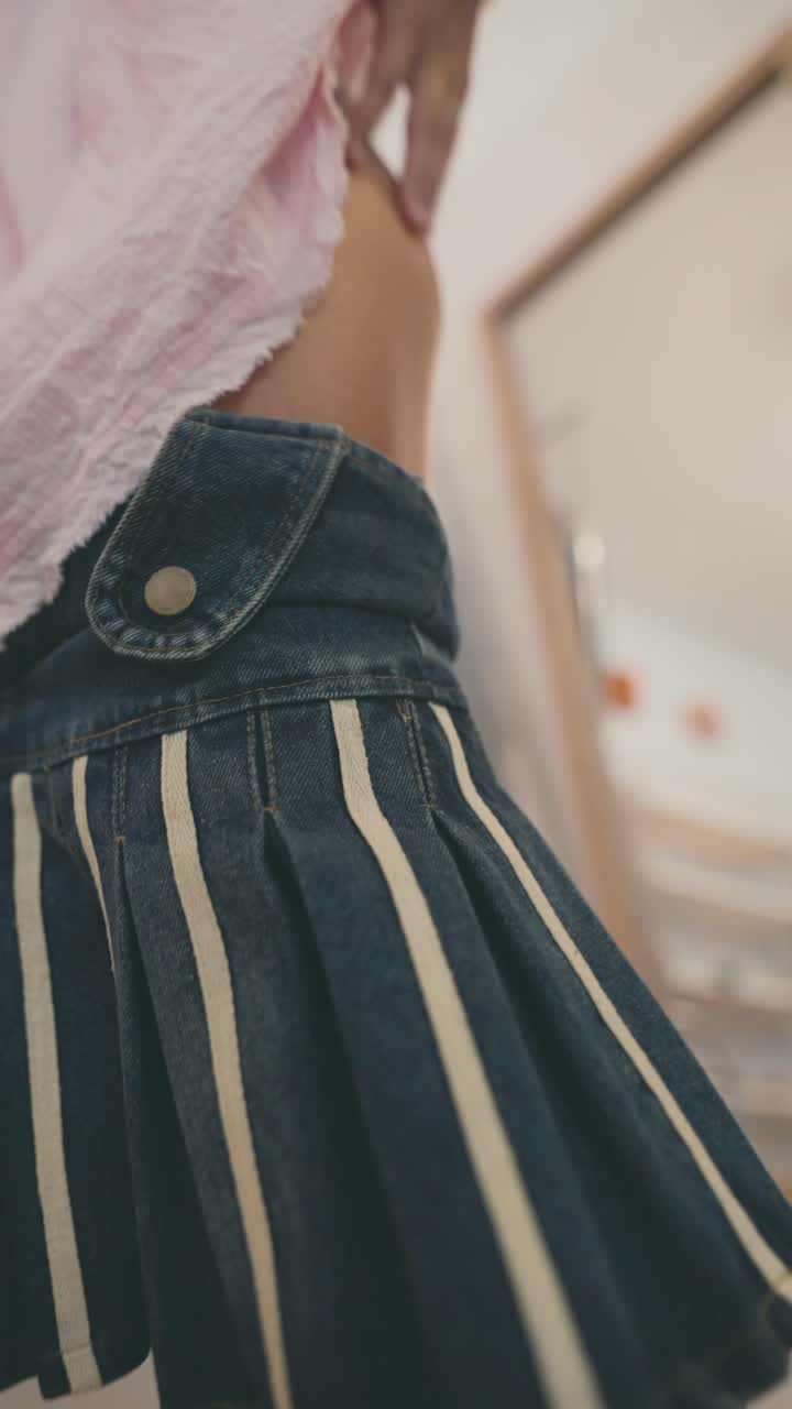 Close-up of a Denim Pleated Skirt