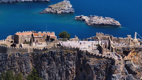 Aerial parallax shot orbiting the Acropolis of Lindos, in sunny Rhodes, Greece