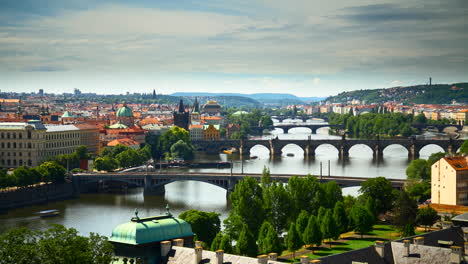 timelapse view down the river in prague towards charles bridge