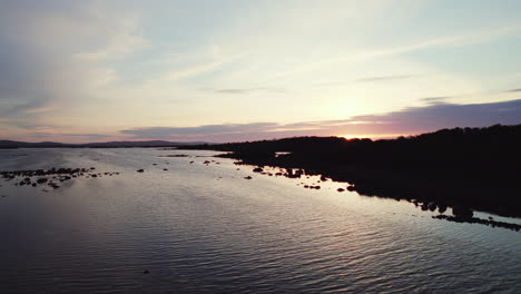 Beautiful-aerial-flying-over-gigantic-irish-lough-corrib-with-many-small-island-silhouettes-in-the-water