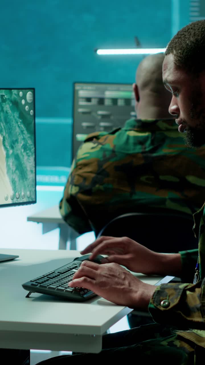 Vertical Video Military experts in mission control center use modern technology on computer