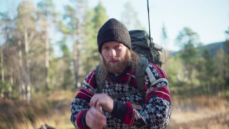 hildremsvatnet, trondelag, norway - a man is preparing for a hiking trip - close up