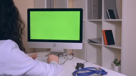 back view doctor using internet consult online