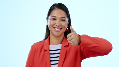 Thumbs-up,-smile-and-face-of-woman-in-a-studio