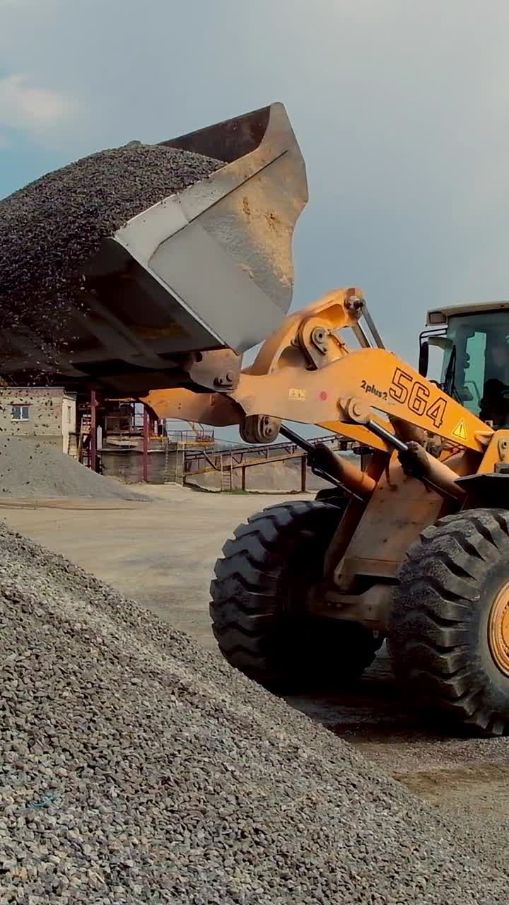 Mining truck driving along road. Industrial heavy machinery working at quarry