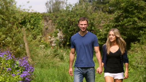 Couple-walking-through-the-countryside