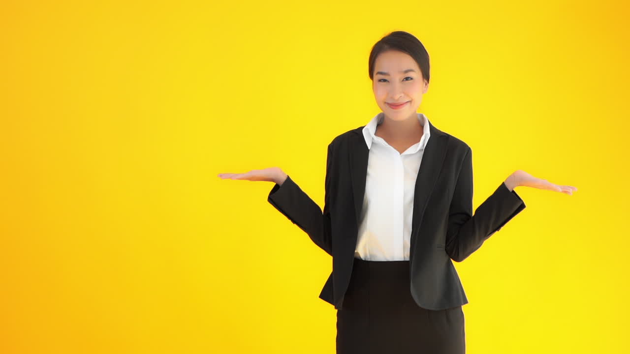An advertising template utilizing the rule of thirds a young professional working woman raises her hands up in a gesture of questioning whatever copy could be placed on the yellow background