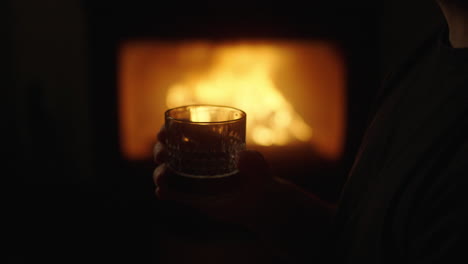 cozy evening by the fireplace with a drink