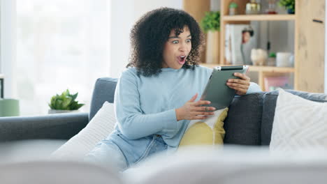 excited woman relaxing and talking on her tablet