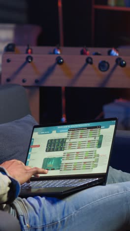 Vertical Video Economic researcher checking monthly balance online on laptop