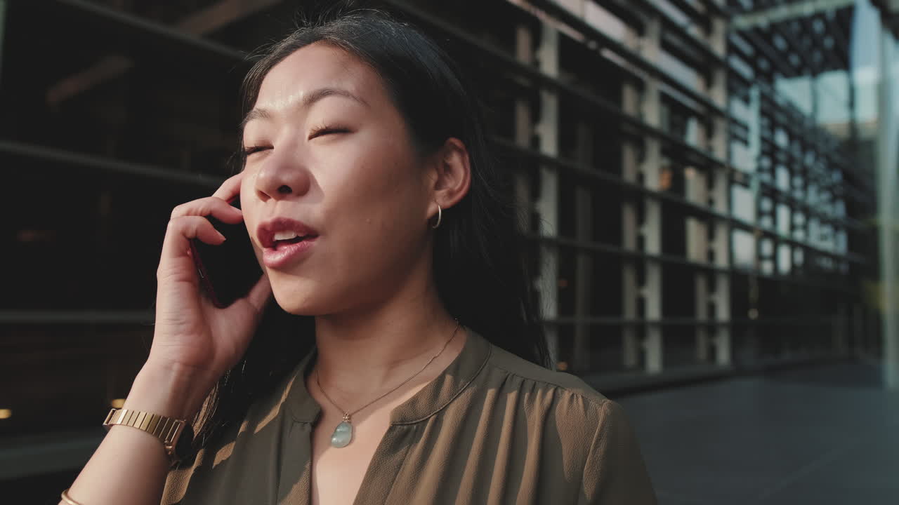 A woman talking on her cell phone outdoors