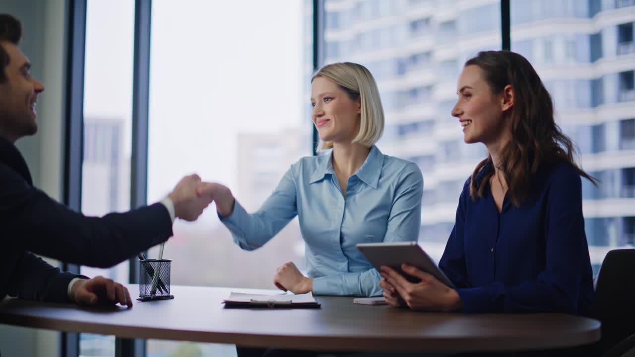 Business Agreement and Job Interview in a Modern Office