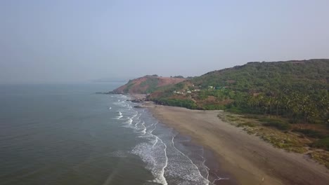 drone shot flying towards the sun and landscape in goa, india