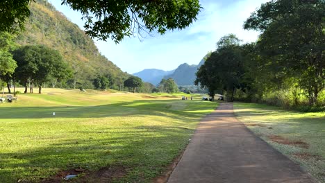 peaceful golf course with mountain backdrop