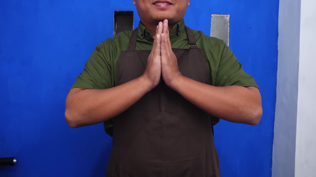Cheerful barista welcomes customers with open arms to modern coffee shop