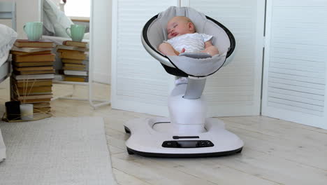 modern high-tech rocking chair helps parents put the child to bed. white interior of children's room