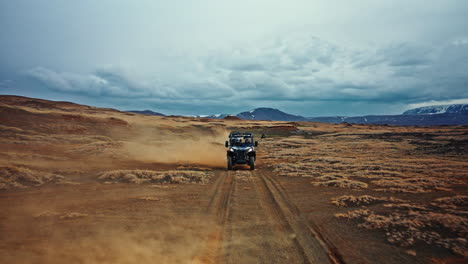 column of atv vehicles exploring the wild volcanic landscapes of iceland