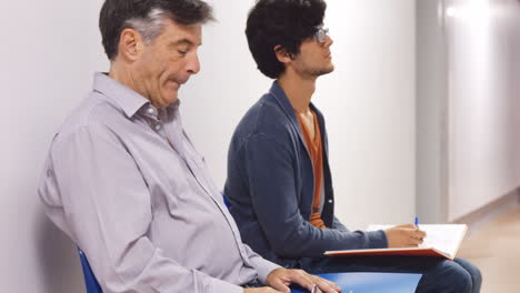 Father-and-son-waiting-in-the-hallways