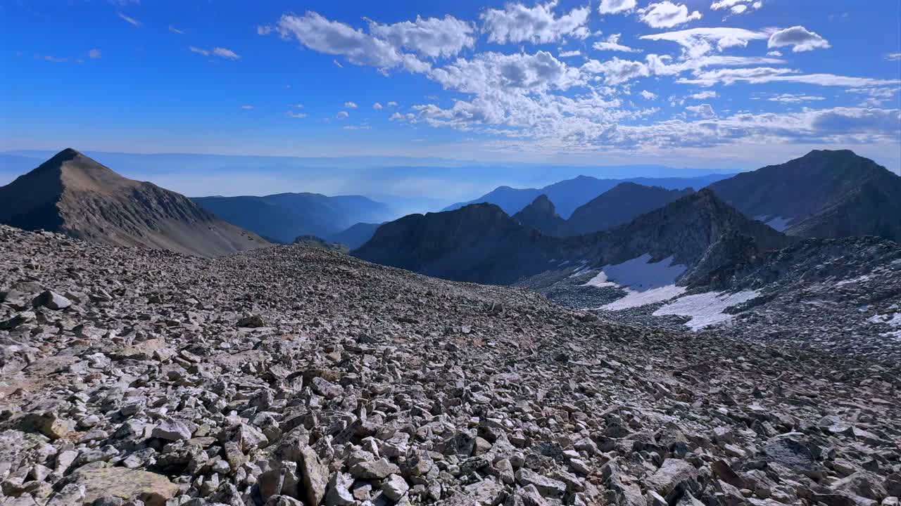 Mt Daly K2 Colorado Rocky Mountain Elk Range landscape boulders snow glacier melt Capitol Peak Trailhead Wilderness NE Ridge route morning high alpine elevation Aspen Snowmass Wilderness pan left