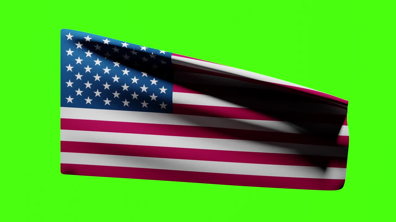 Flag of the USA, United States of America blown in the wind on a green background