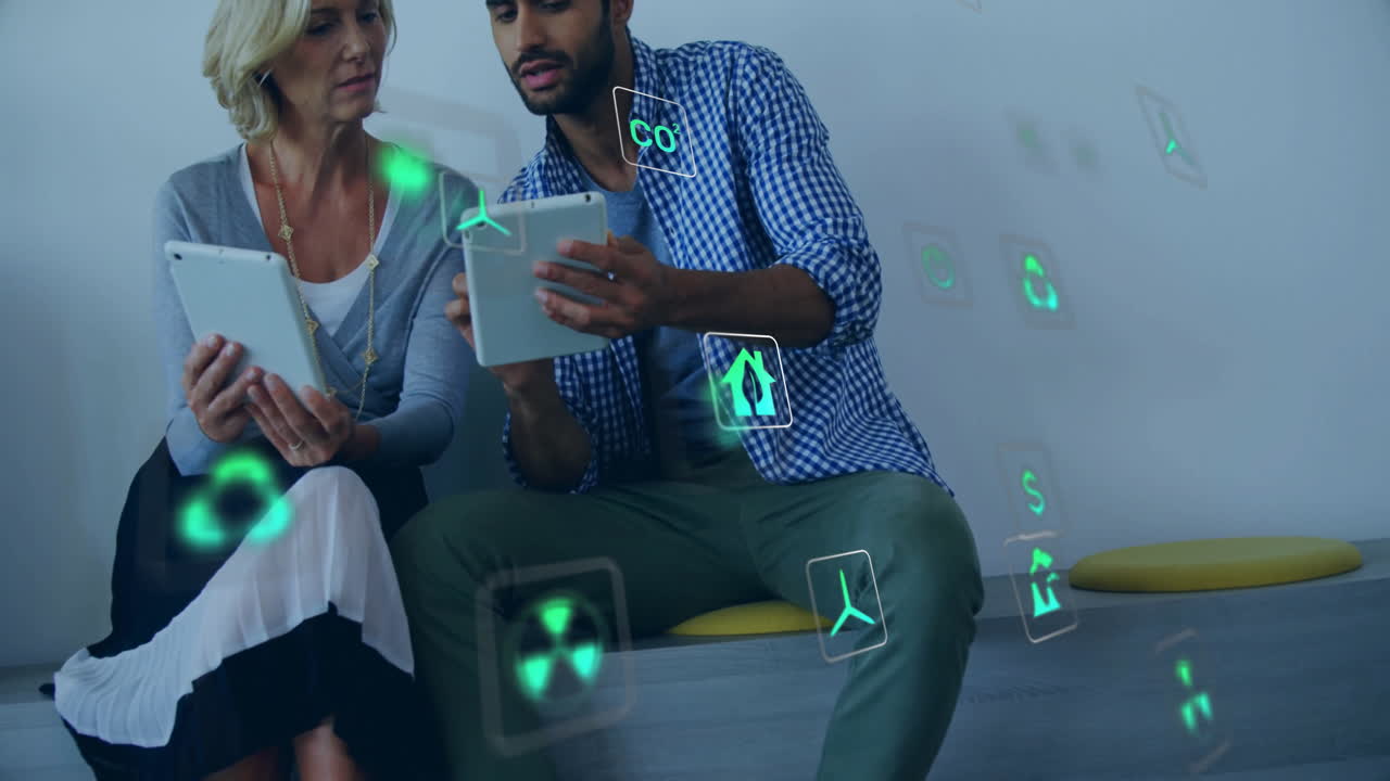 Animation of eco icons and data processing over diverse business people in office
