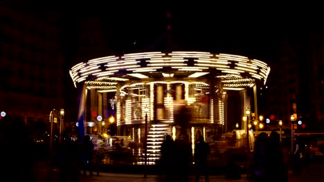 timelapse of merry go round carousel park attraction at night